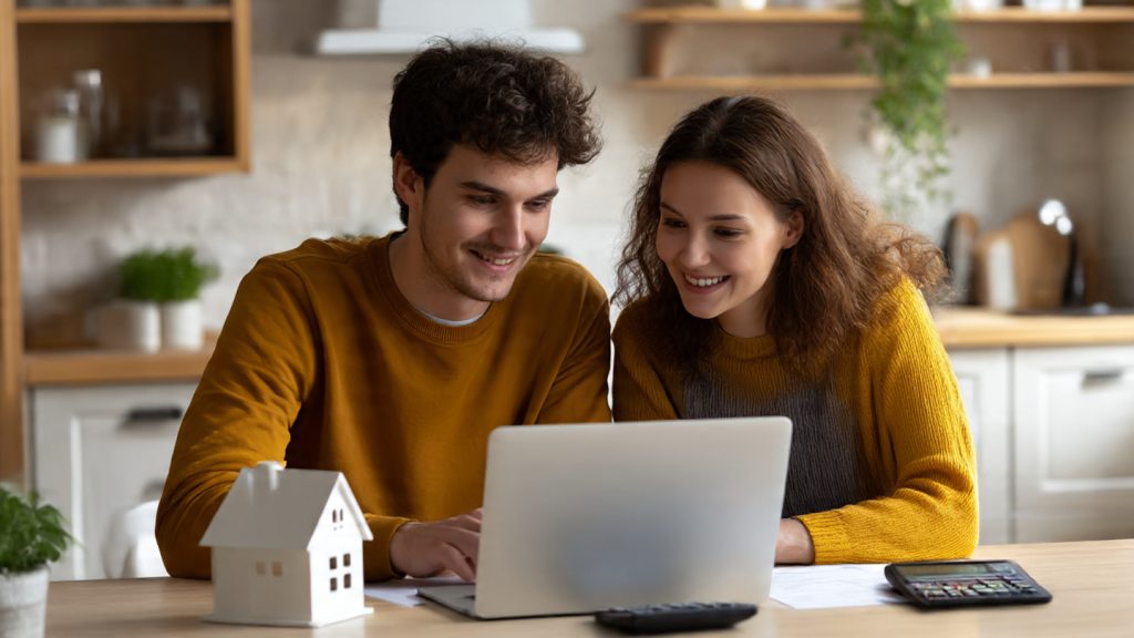 Person reviewing borrowing costs and repayments on a laptop in Ireland - safer borrowing decisions